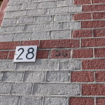 House number 28, with faint number 36 next to it